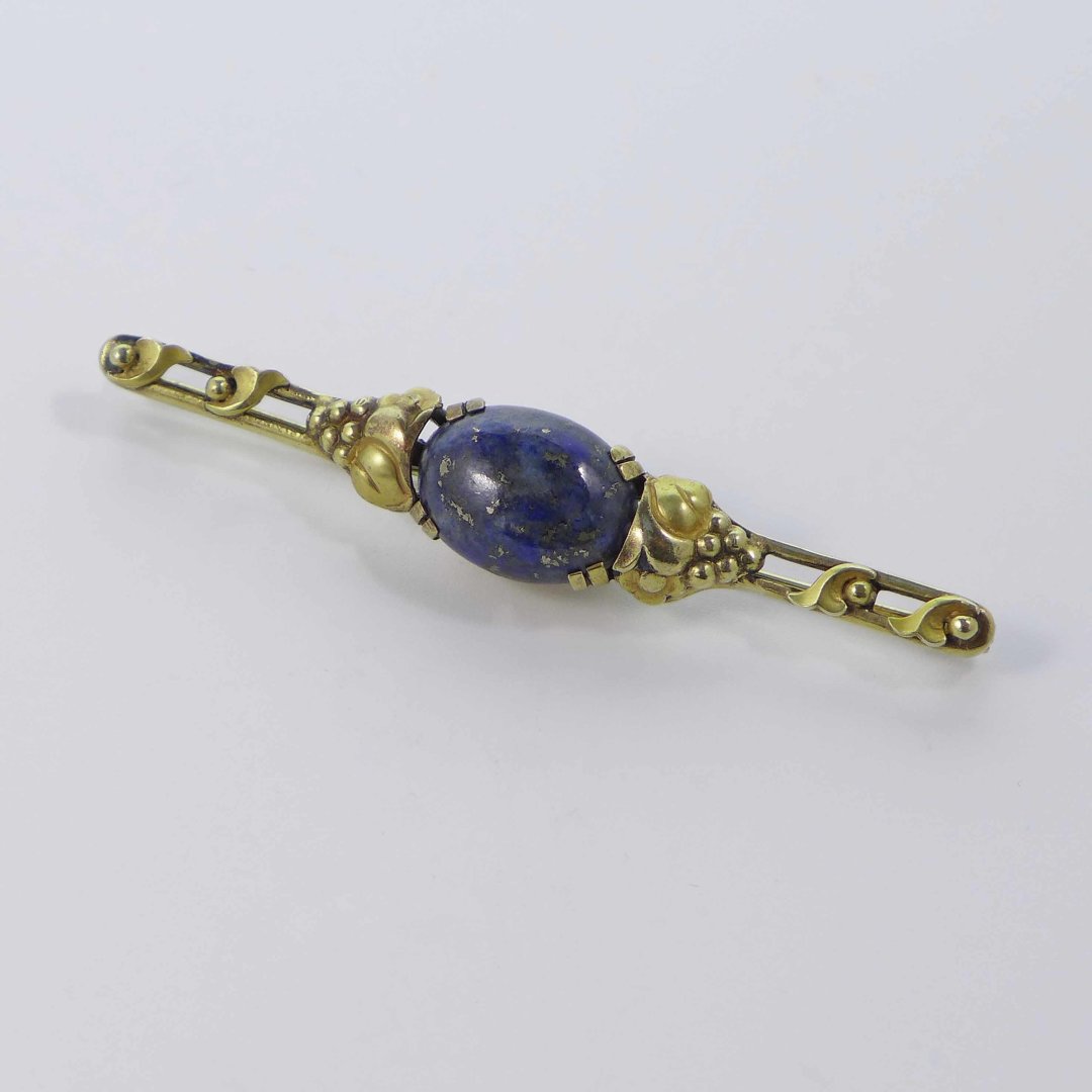 Gilt art nouveau brooch with lapis lazuli