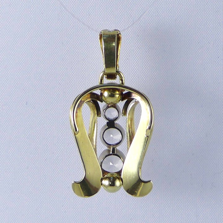Gold pendant from the 1930s with white topazes