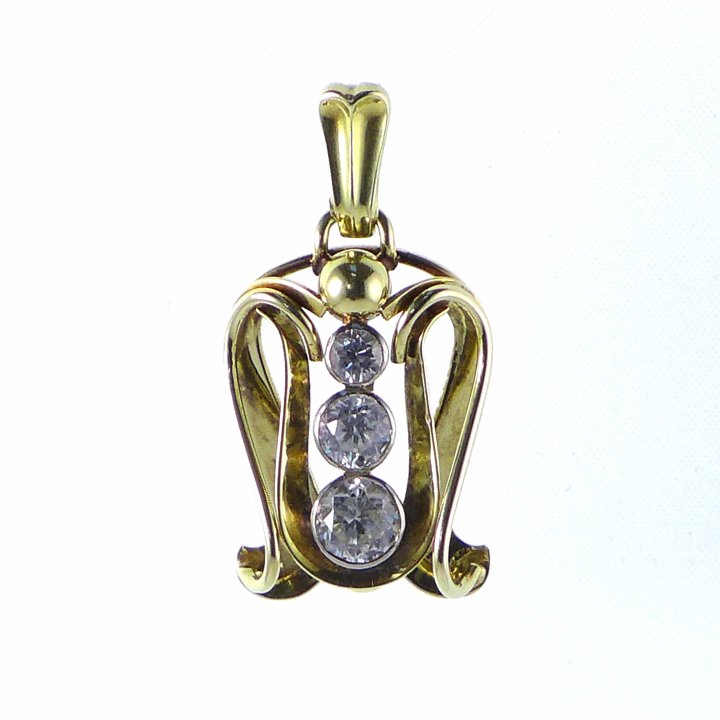 Gold pendant from the 1930s with white topazes