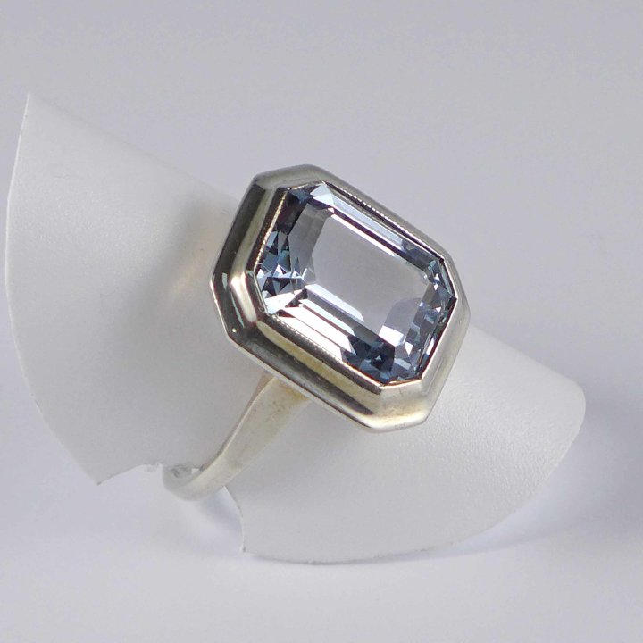 A. Clear - Silver ring with aquamarine spinel