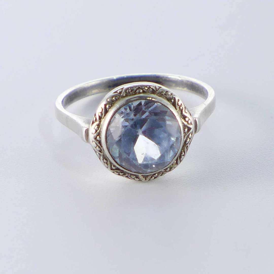 Round silver ring with water blue stone