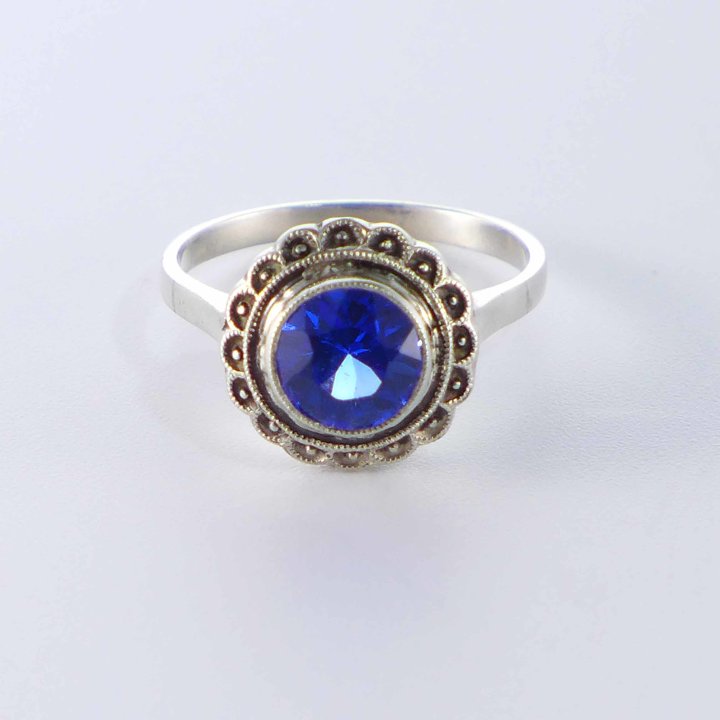 Round silver ring with bright blue crystal glass