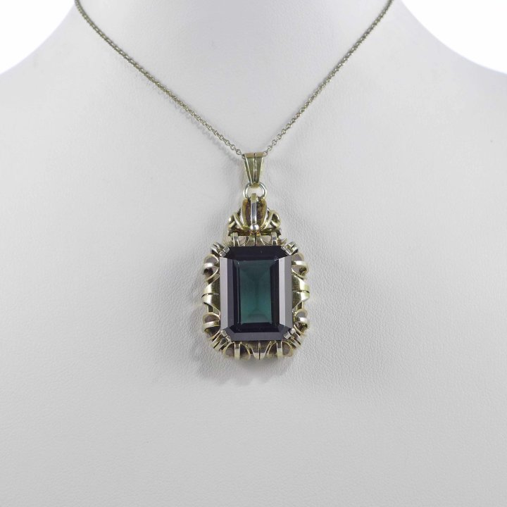 Gold plated pendant with bottle green stone
