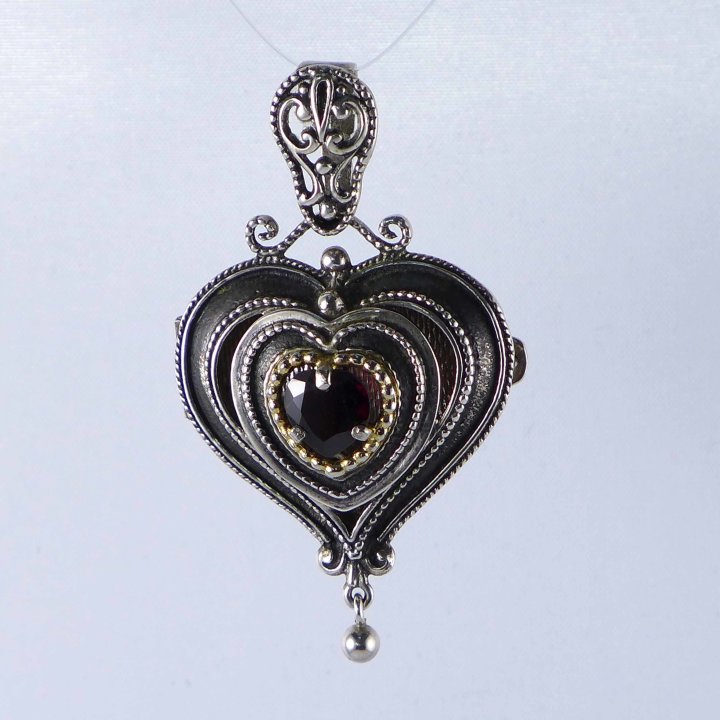 Heart shaped locket with garnet