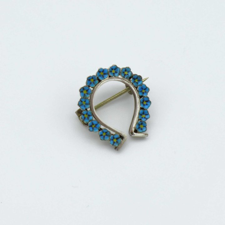 Horseshoe brooch with enameled forget-me-nots
