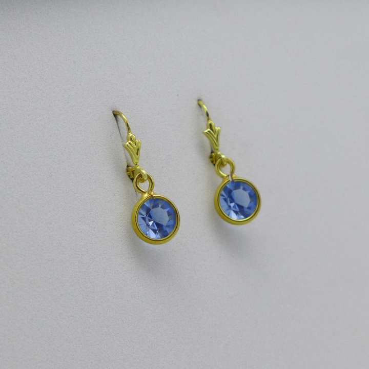 Gold-plated earrings with light blue stone