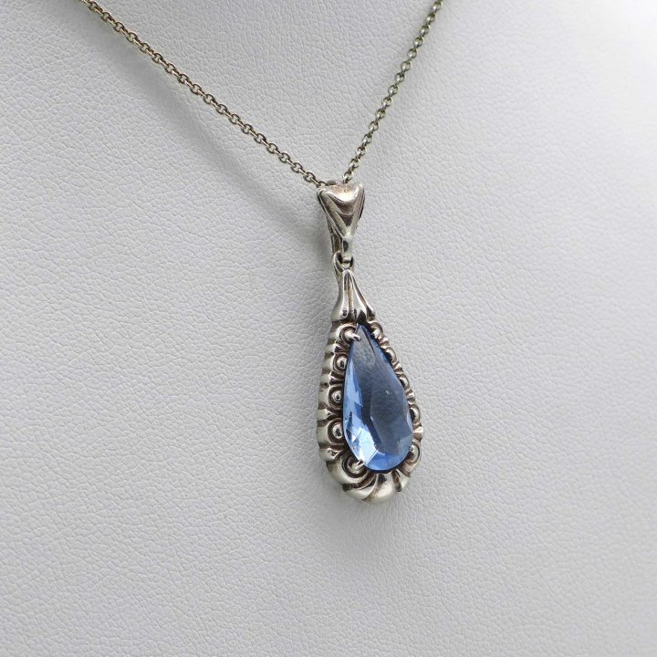 with cut light blue crystal glass.