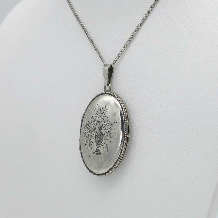 Oval Silver Medallion with Flower Vase