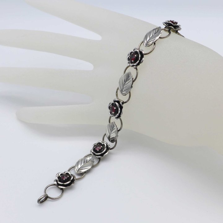 Silver bracelet with roses and pomegranates
