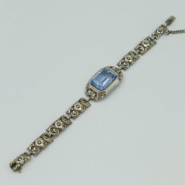 Silver bracelet with flowers and light blue spinel from the 1930s