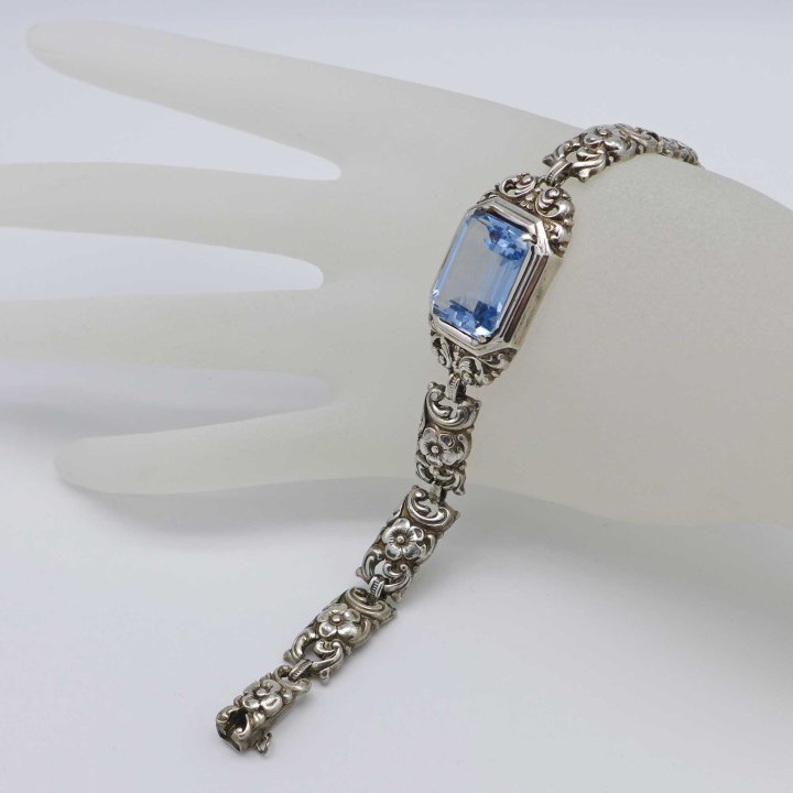 Silver bracelet with flowers and light blue spinel from the 1930s
