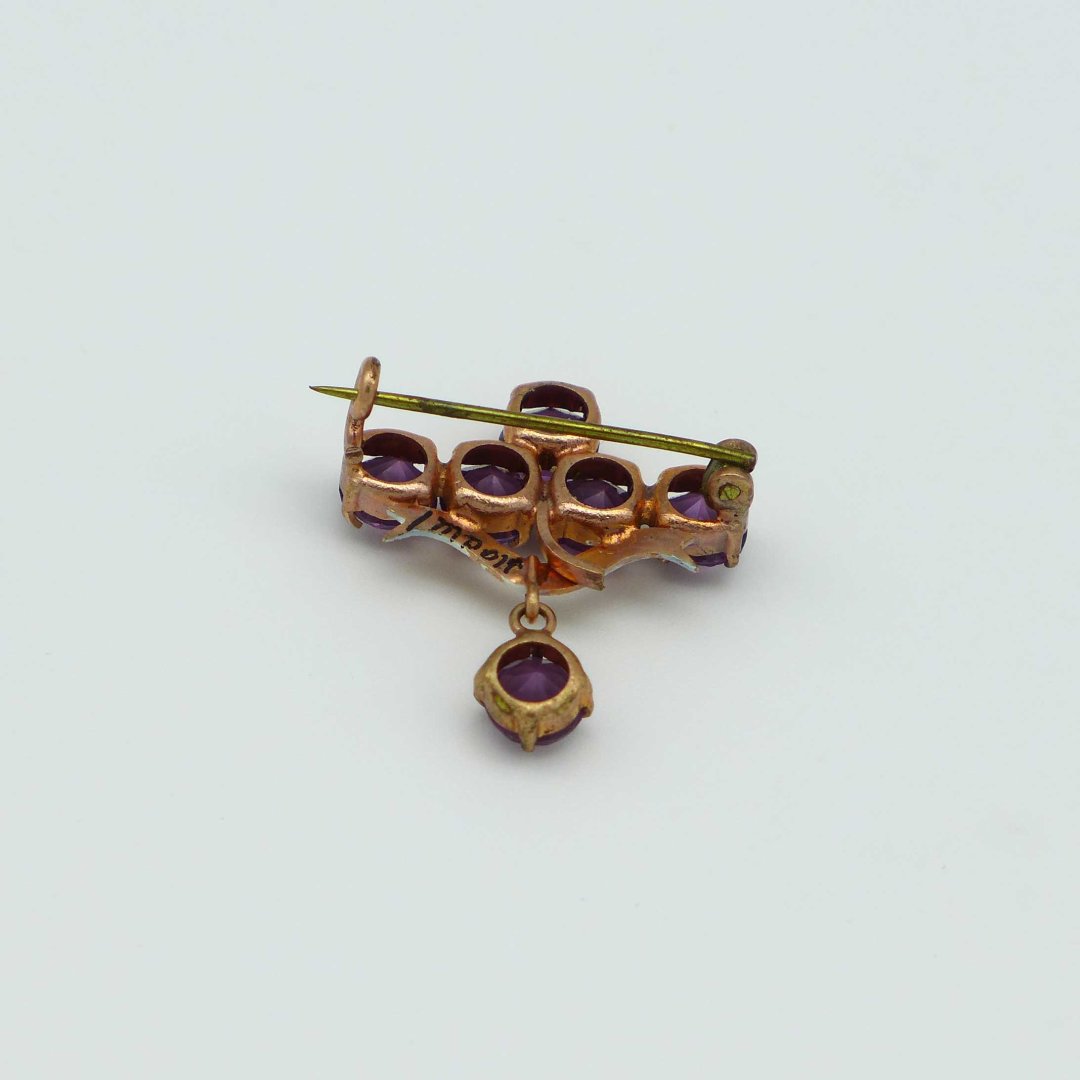 Art Nouveau brooch with purple rhinestones