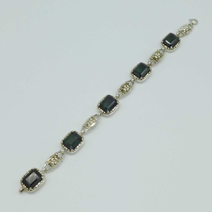 Silver bracelet with flowers and green stones