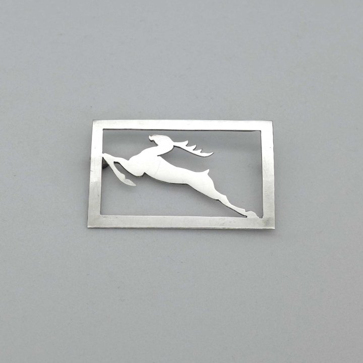 Sawn silver brooch with stag