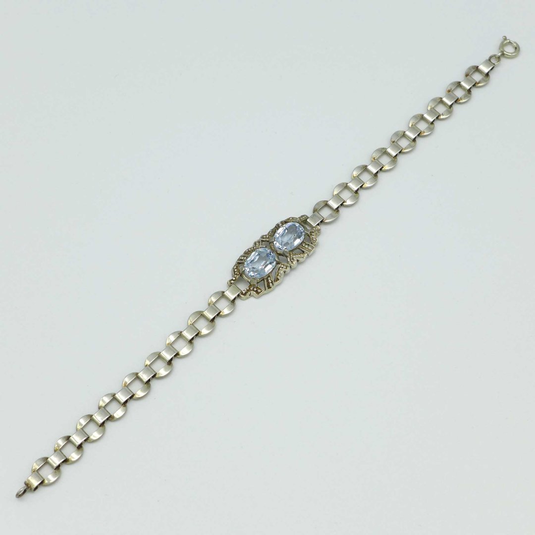Silver bracelet with light blue stones