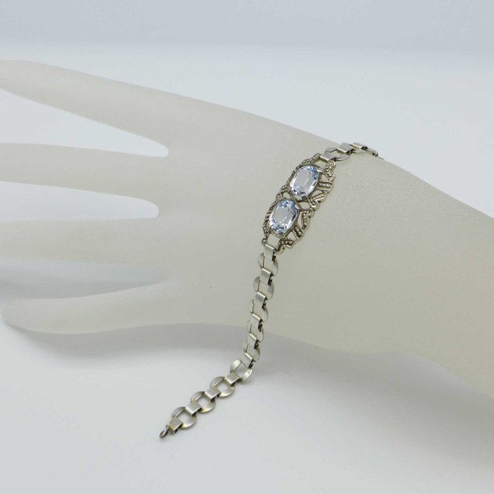 Silver bracelet with light blue stones
