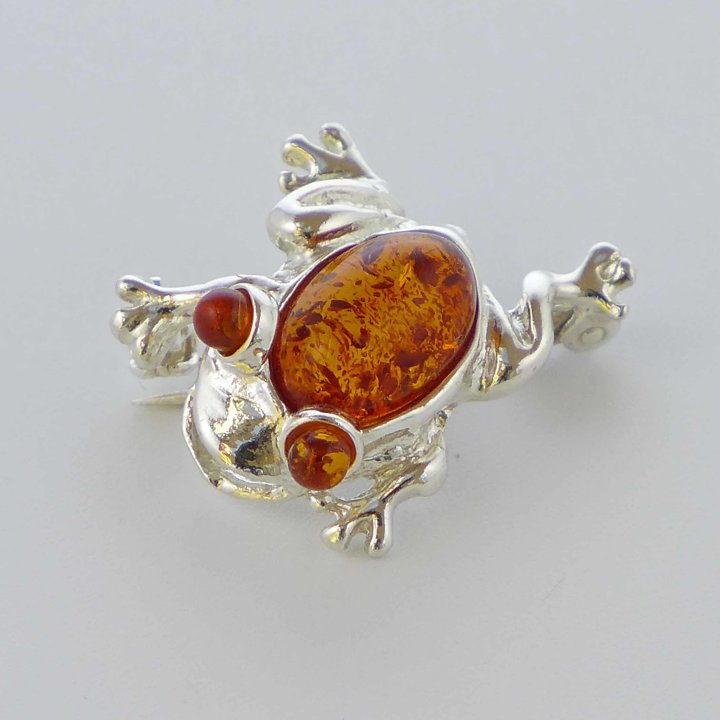 Frog silver brooch with amber