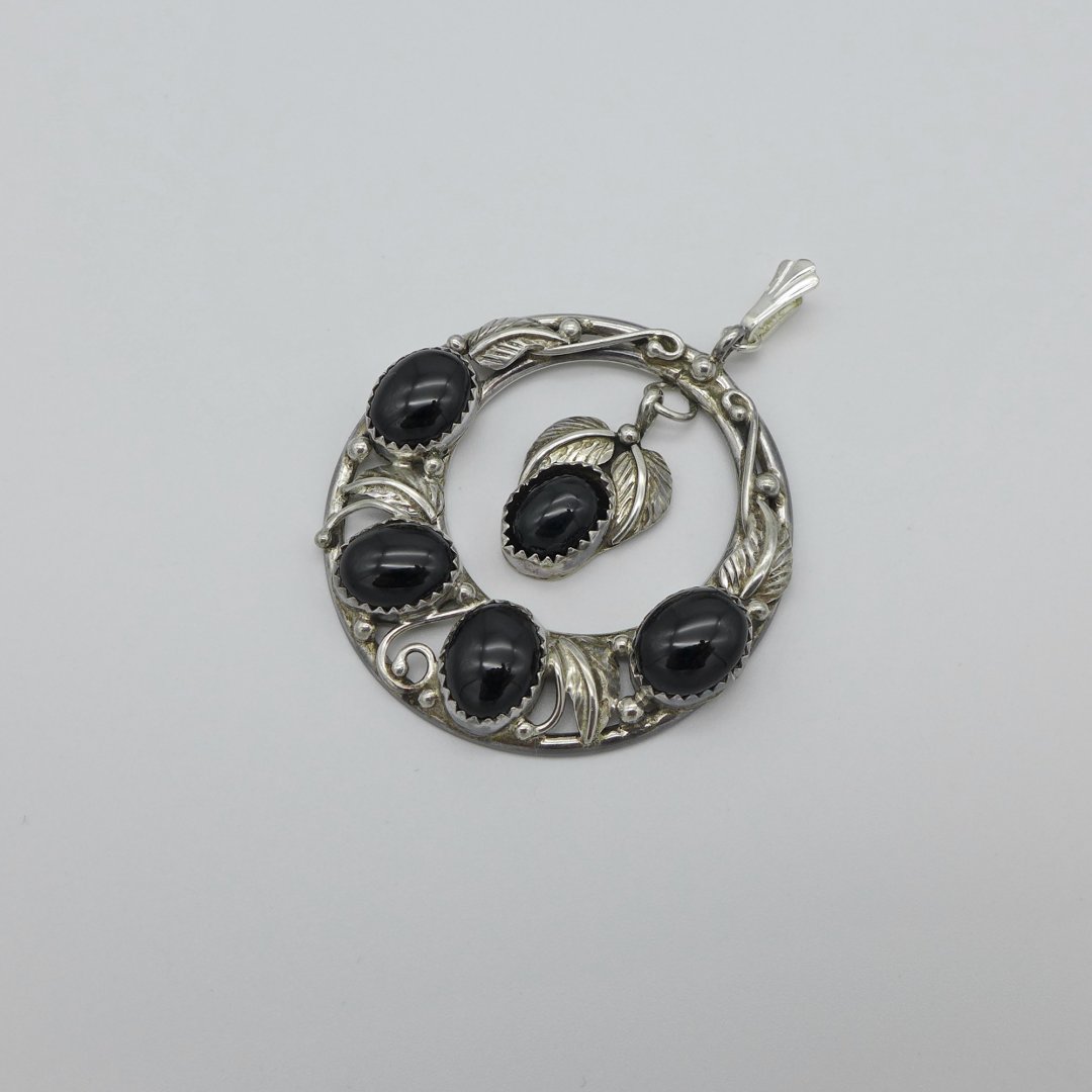 Round silver pendant with black obsidian
