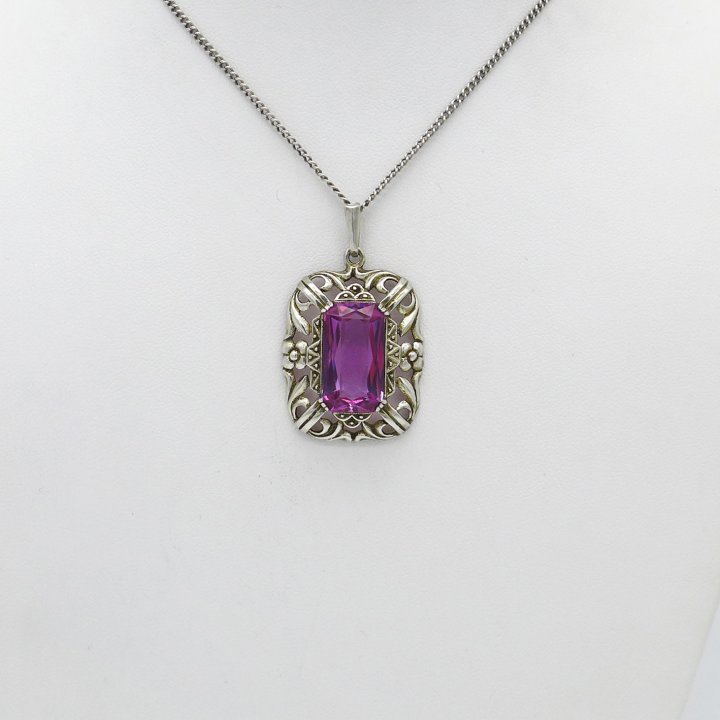 Silver pendant with pink stone