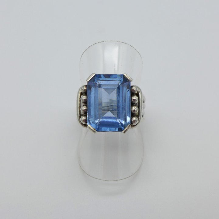Handmade silver ring with light blue stone.