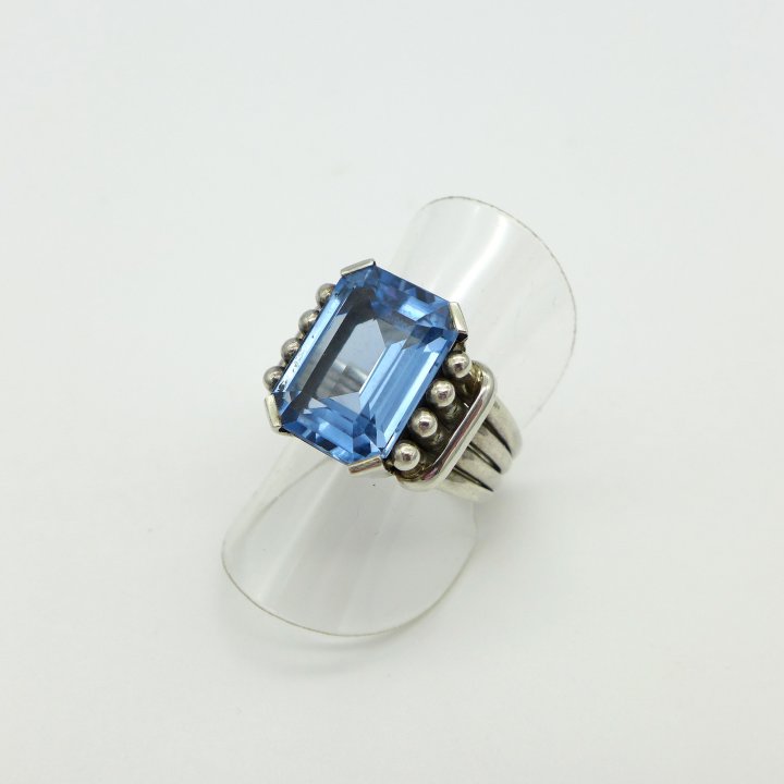 Handmade silver ring with light blue stone.