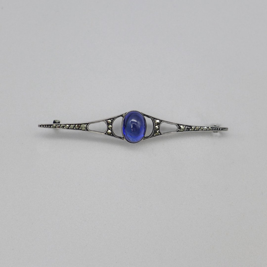 Art nouveau pin with marcasites and sapphire blue stone