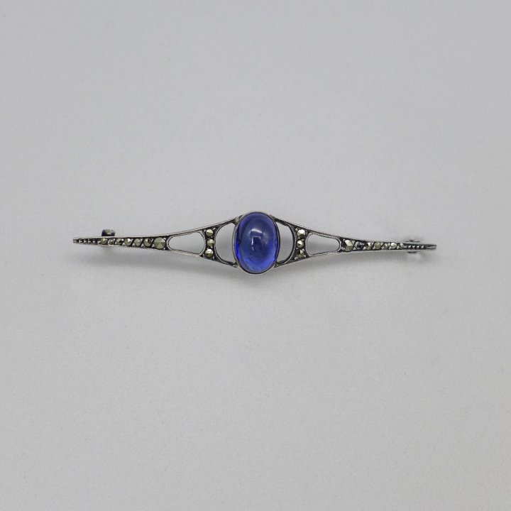 Art nouveau pin with marcasites and sapphire blue stone