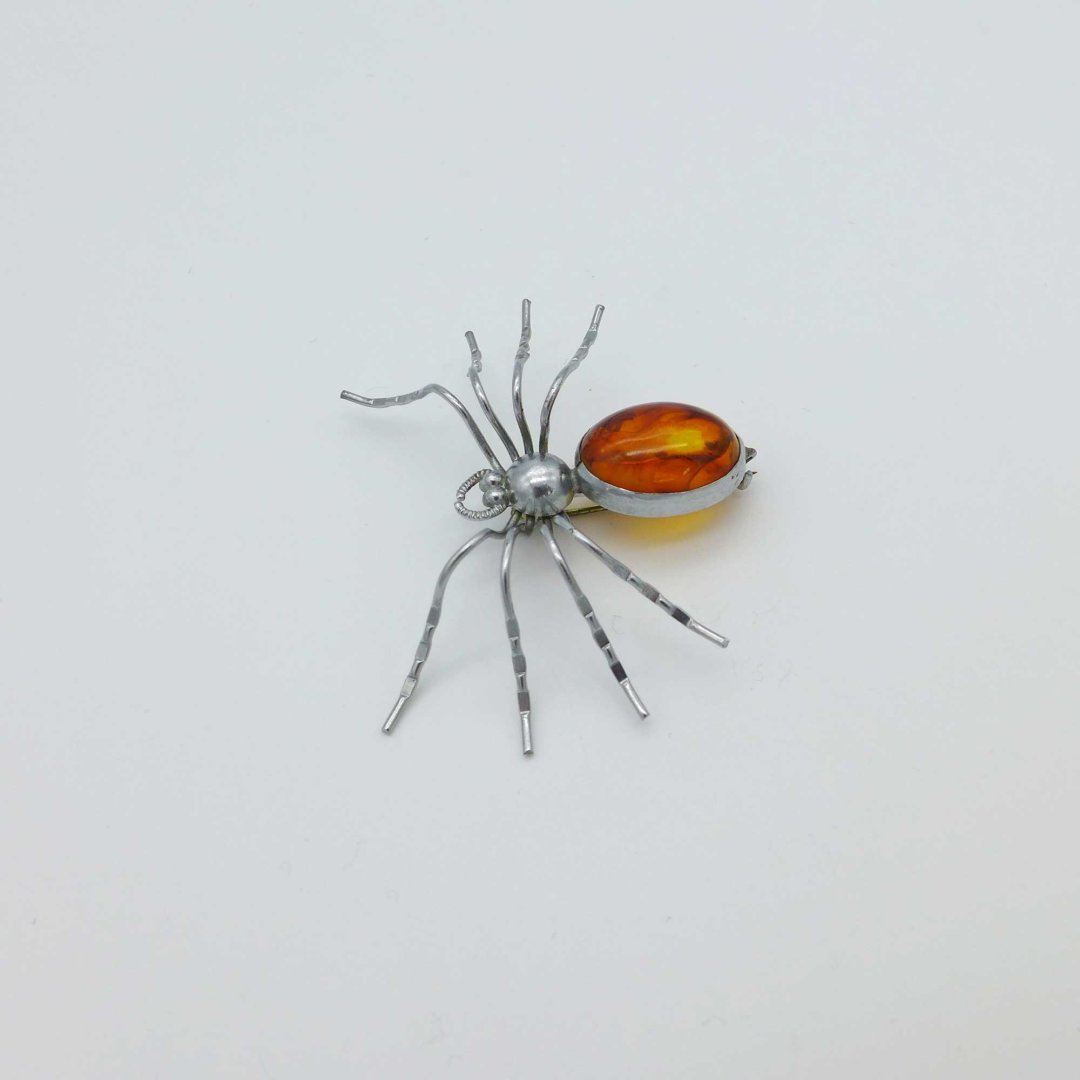 Spider brooch with amber