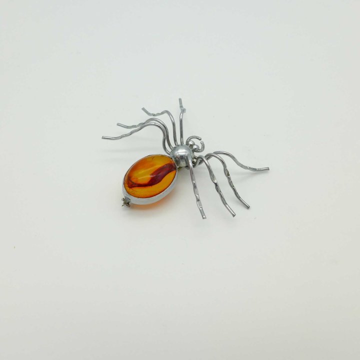 Spider brooch with amber
