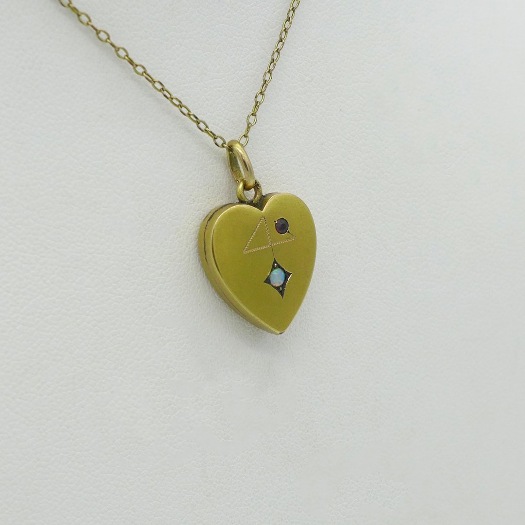 Gold heart with opal