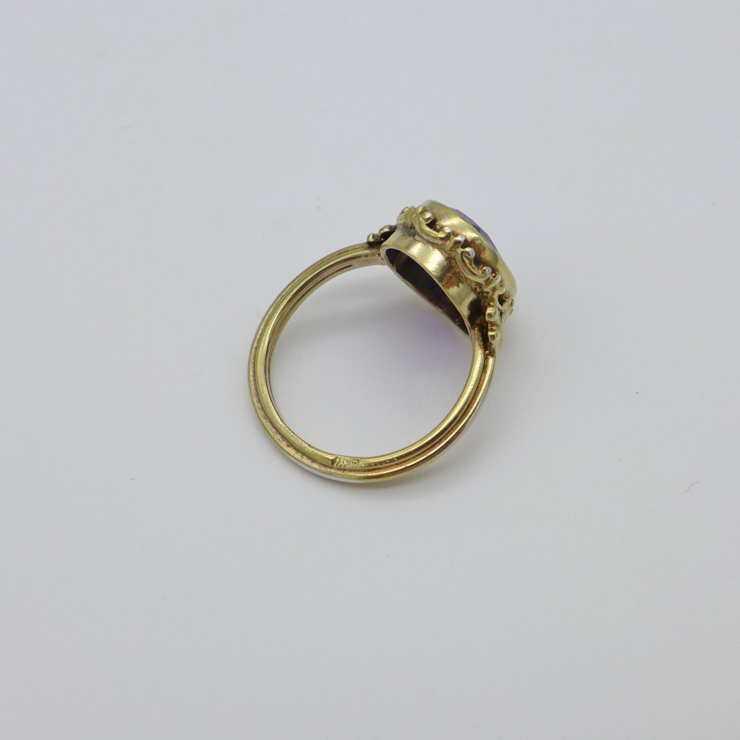 Gilt silver ring with dark amethyst