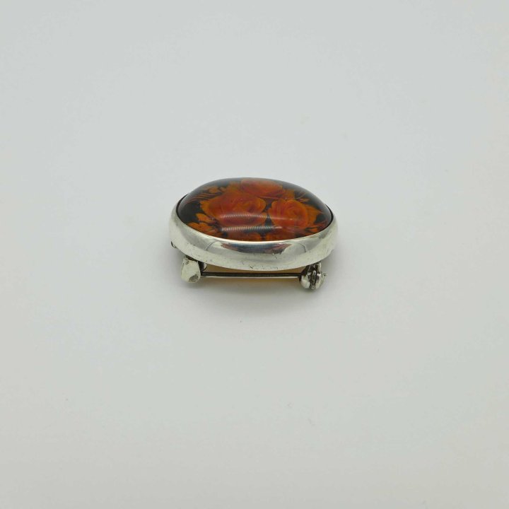 Brooch-pendant with engraved amber