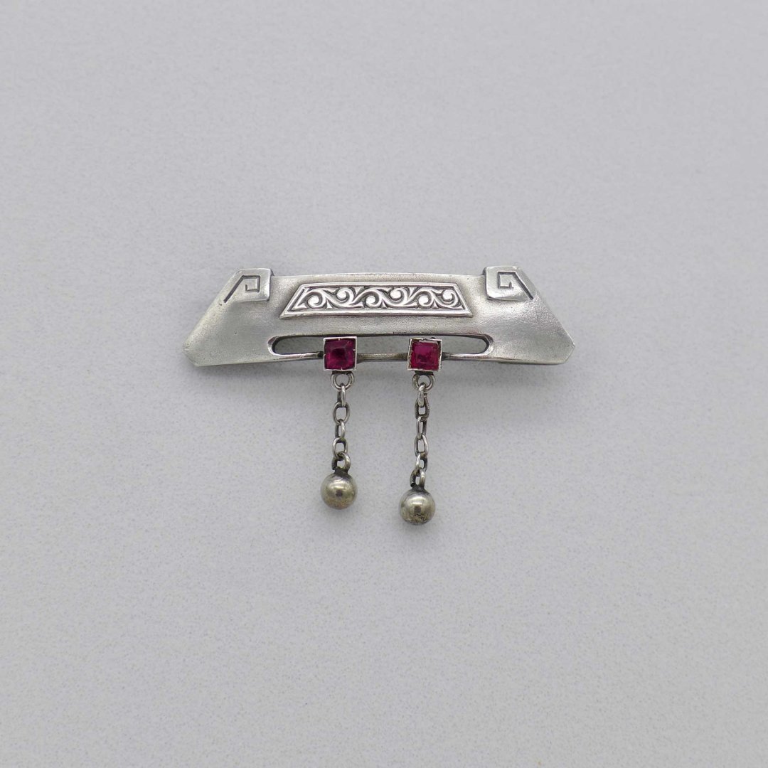 Art Nouveau pin with ruby red stones