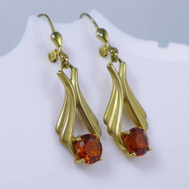 Gold earrings with topazes in cognac brown