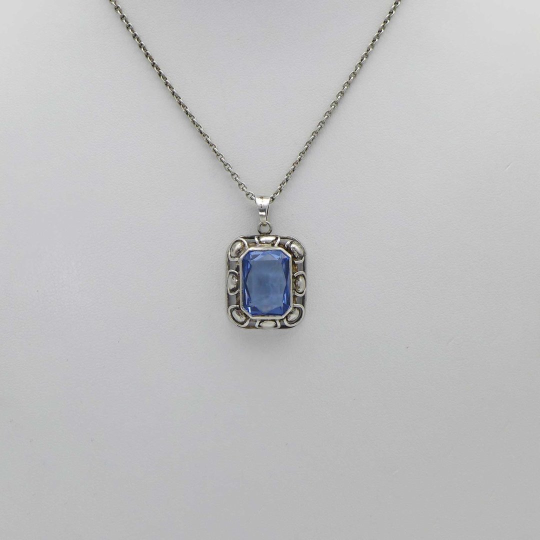 Silver pendant with water blue stone