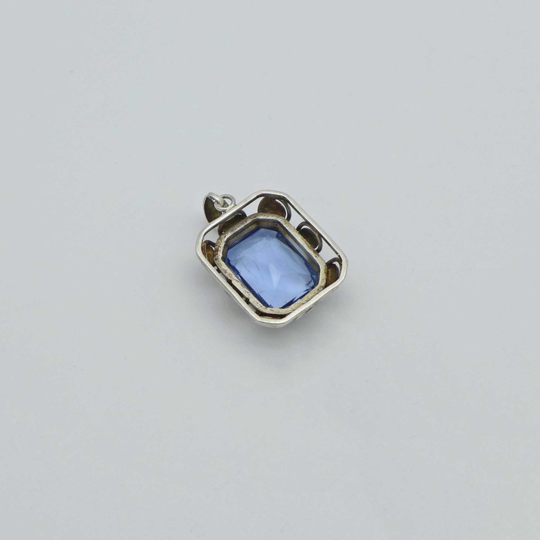 Silver pendant with water blue stone