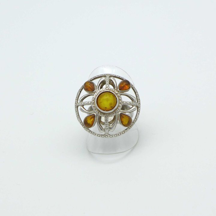 Shield-shaped silver ring with amber stones