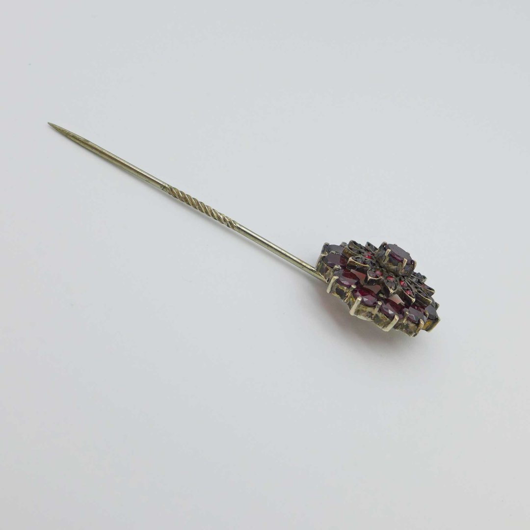 Lapel pin with garnet flower