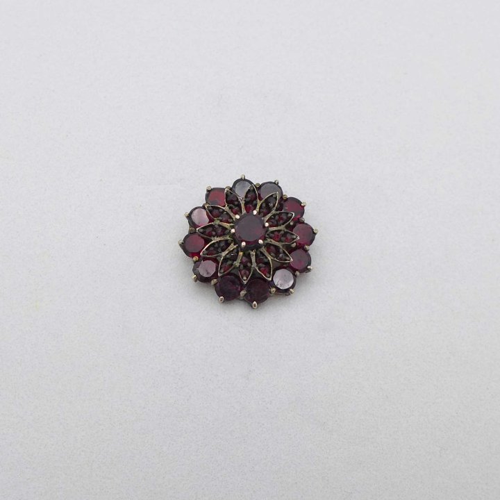 Lapel pin with garnet flower