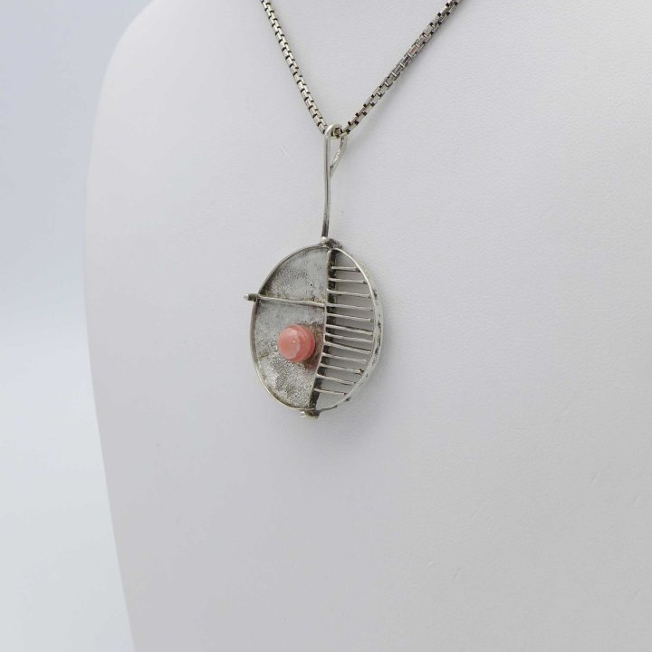 Handcrafted silver pendant with rhodochrosite