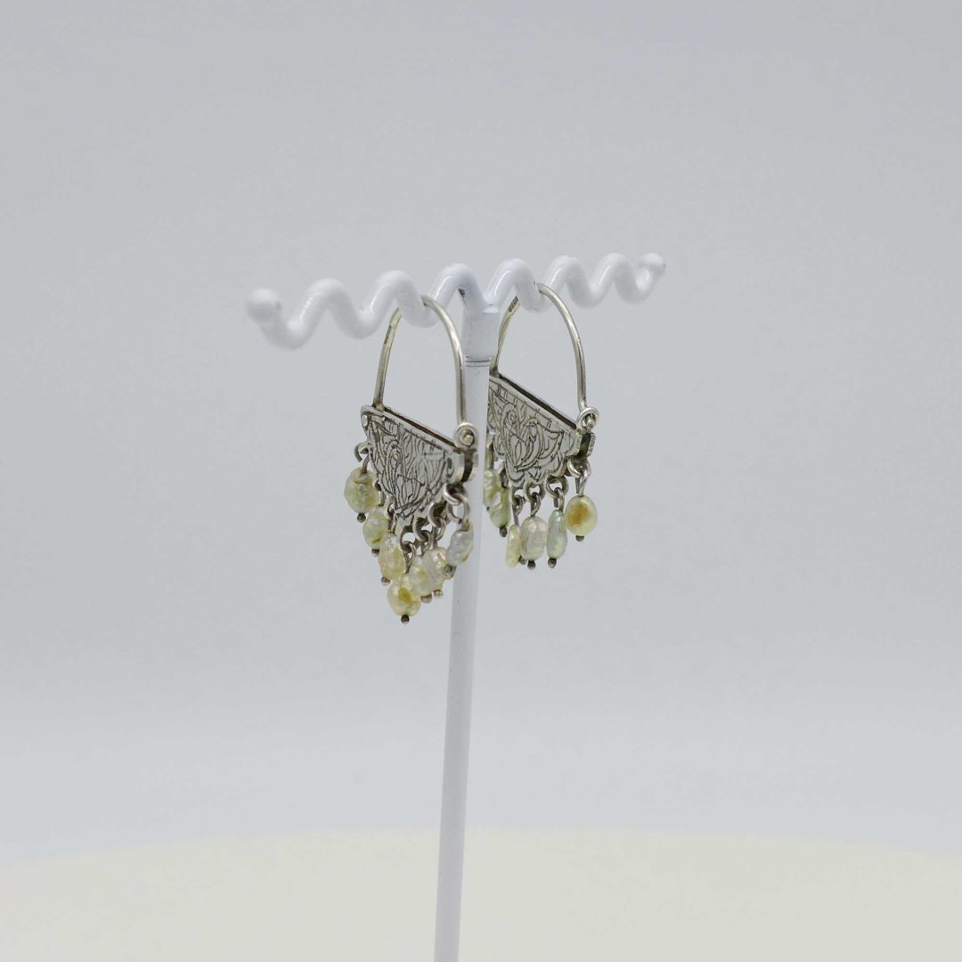 Playful silver earrings with baroque pearls