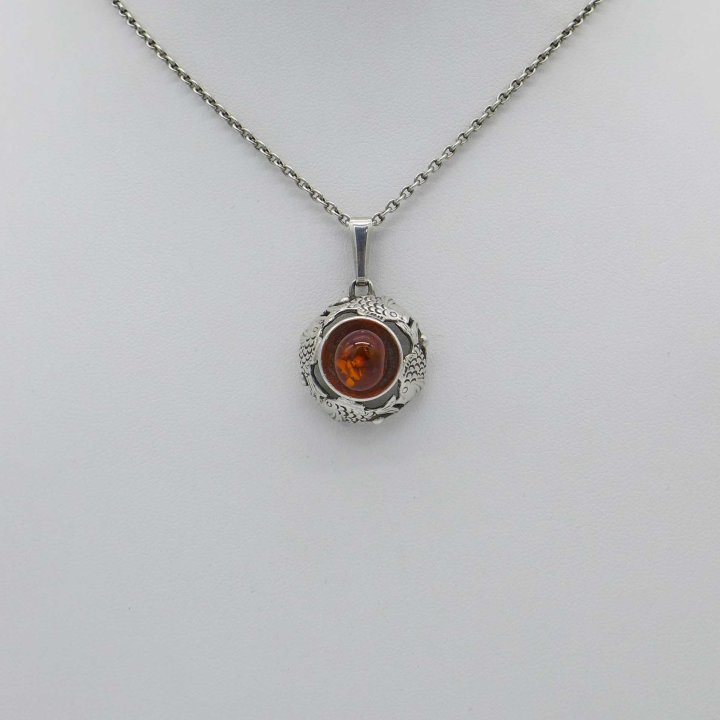 Fischland - Round pendant with amber and fish motifshland...