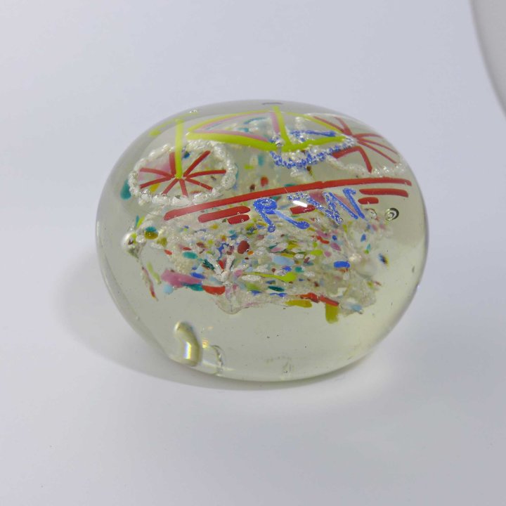 Glass paperweight with monogram RW and bicycle