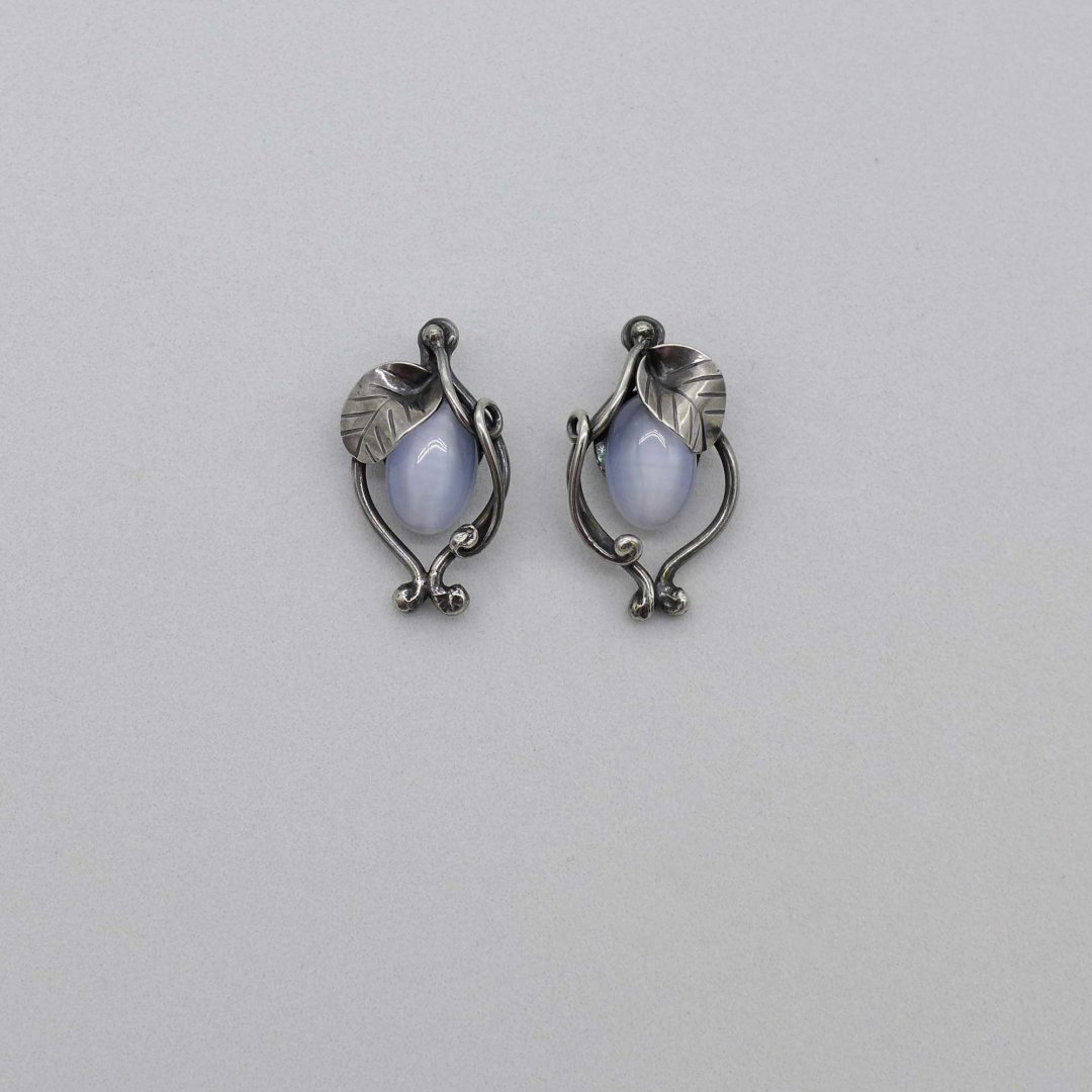 Floral silver ear studs with cats eye