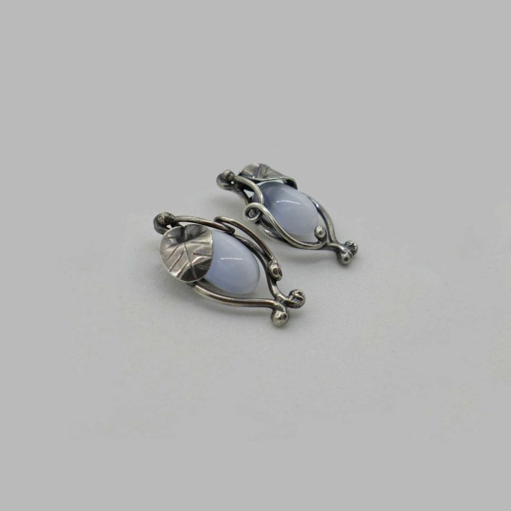 Floral silver ear studs with cats eye