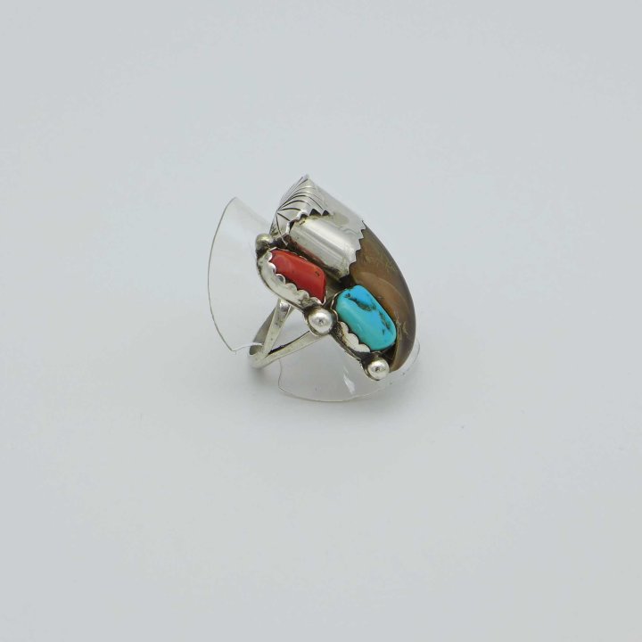 Handmade ring with animal claw, coral and turquoise.