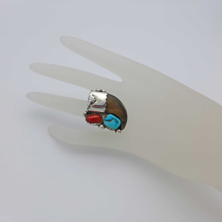 Handmade ring with animal claw, coral and turquoise.