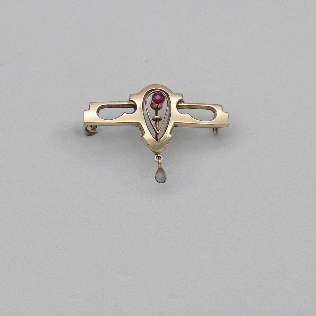 Art Nouveau pin with ruby red stone and opal