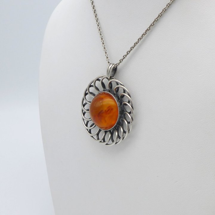 Round amber pendant from the 1930s