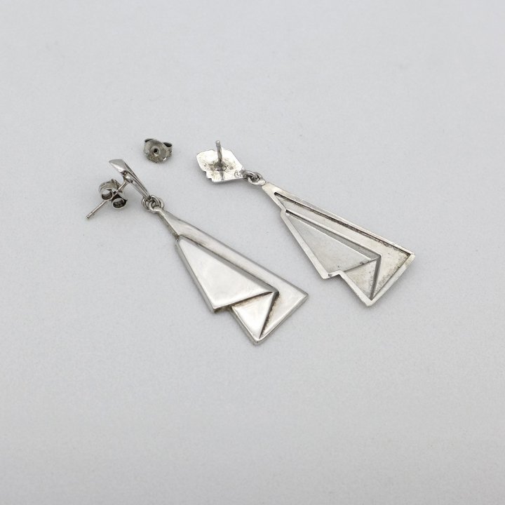 Silver ear studs Curtain